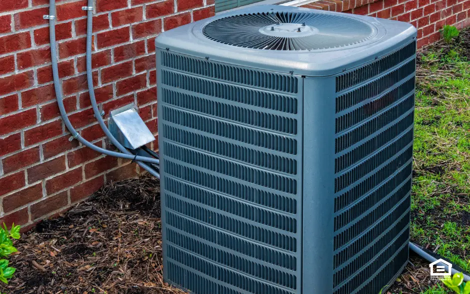 External air conditioner outside red brick building