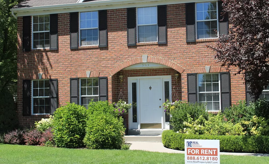 home with rental sign