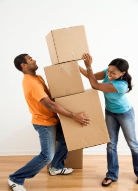 happy couple moving boxes