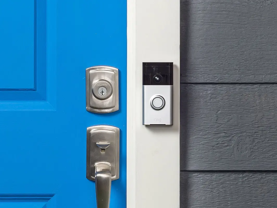 Ring smart doorbell mounted by door