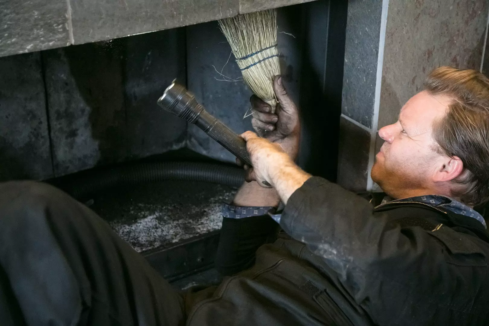 Chimney Inspection. Cleaning fireplace inside of home