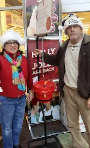 Jason and Yvonne Schmitt with a Salvation Army kettle.