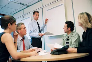 A group of office workers in a meeting