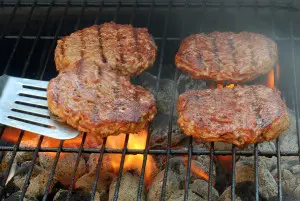 Hamburgers over hot coals