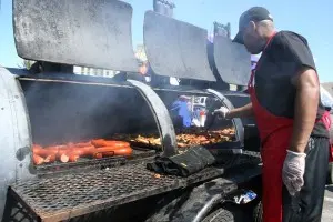 Man cooking food on smokers