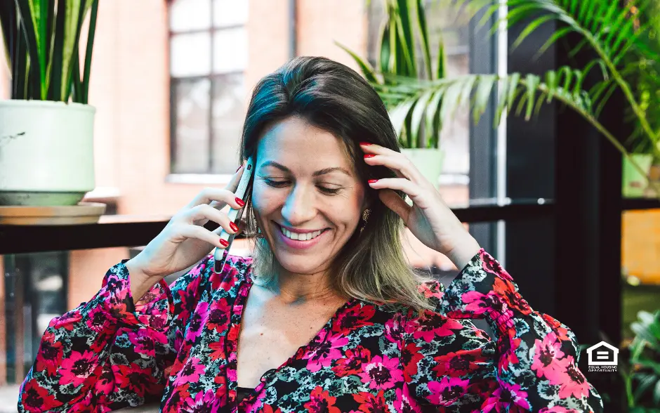 smiling woman talking on the phone