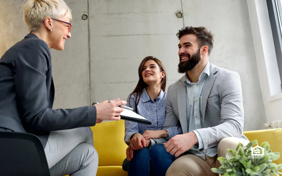 Woman and couple sitting and discussing real estate future