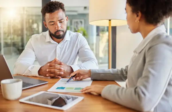 Tax consultant going over taxes with customer.