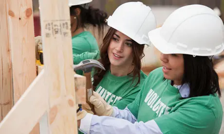 Volunteers working on a project building a structure