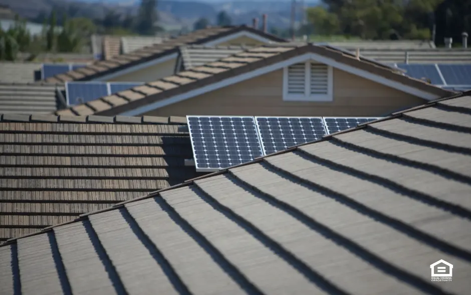 House roofs many with solar panels