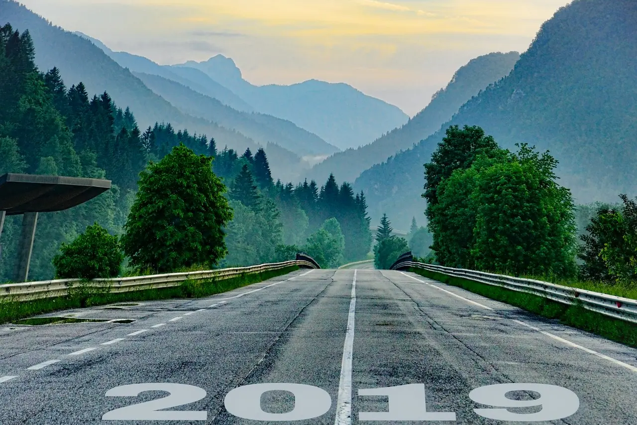 Road in the mountains with the year 2019 on the road